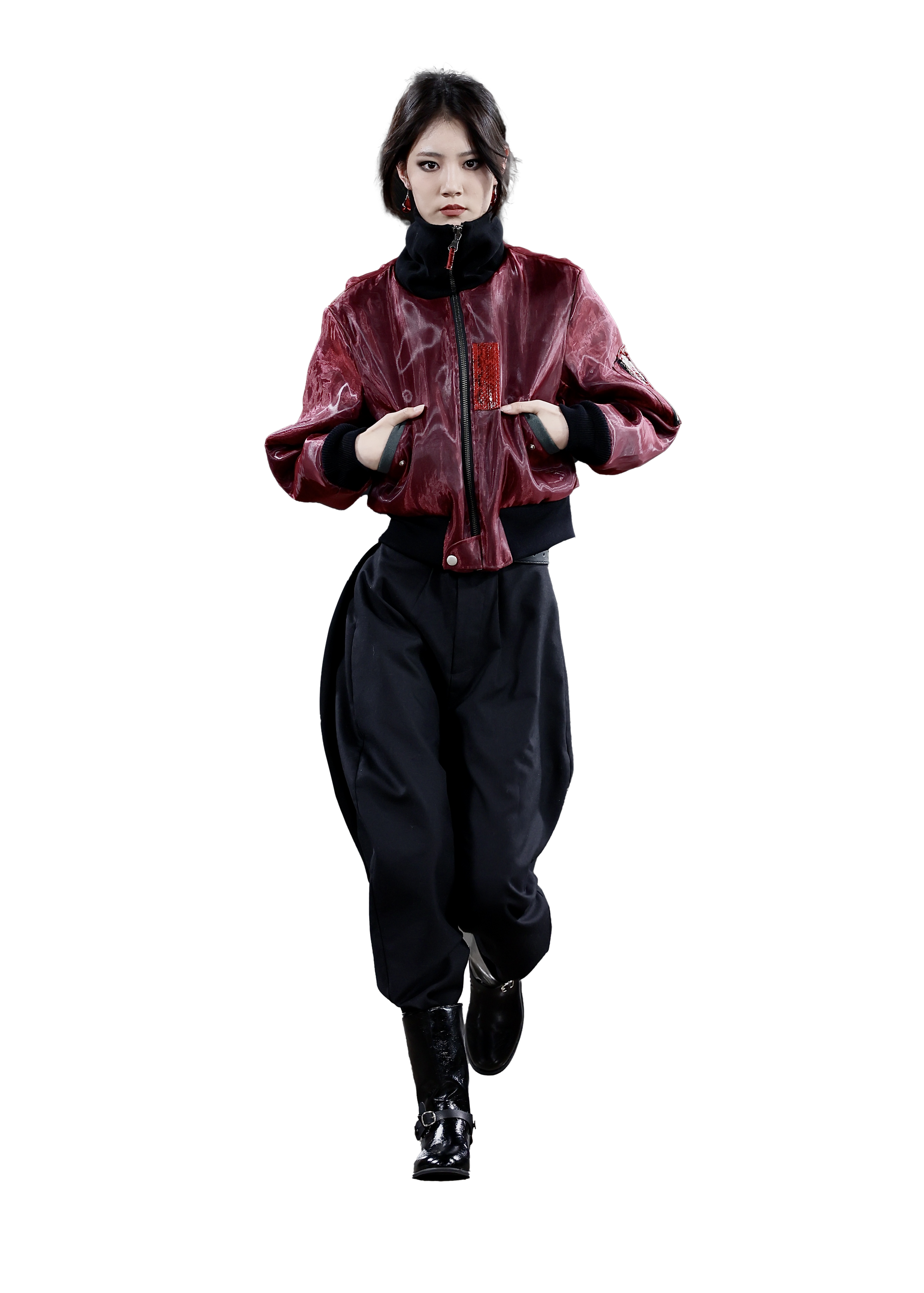 Person wearing a red jacket and black pants on a white background